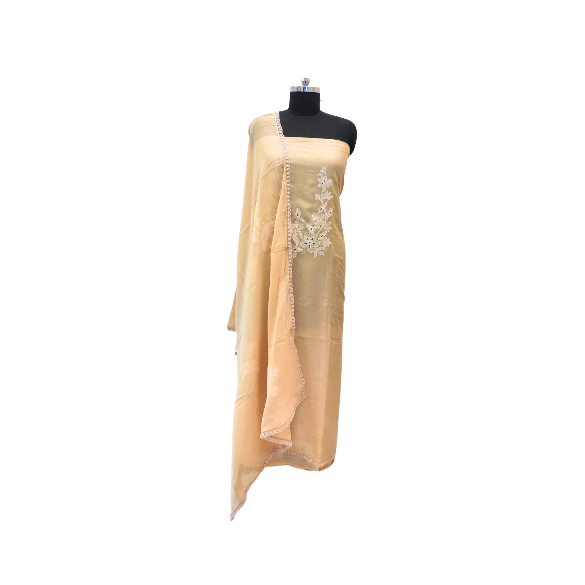 Muslin suit with intricate machine embroidery, paired with a muslin dupatta featuring delicate thread work lace — elegant and graceful.
