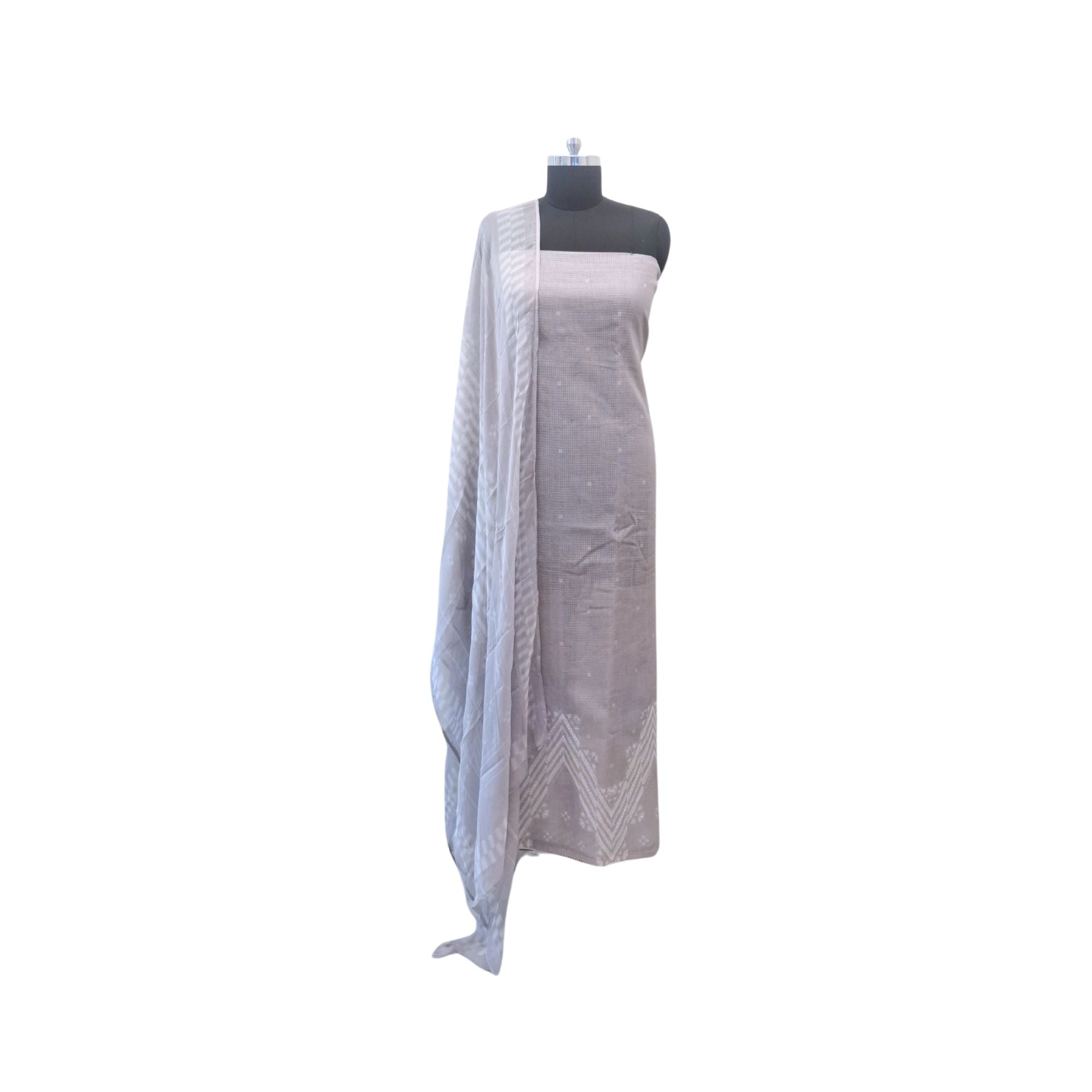 Modern geometry on classic linen, completed with a lightweight chiffon dupatta.