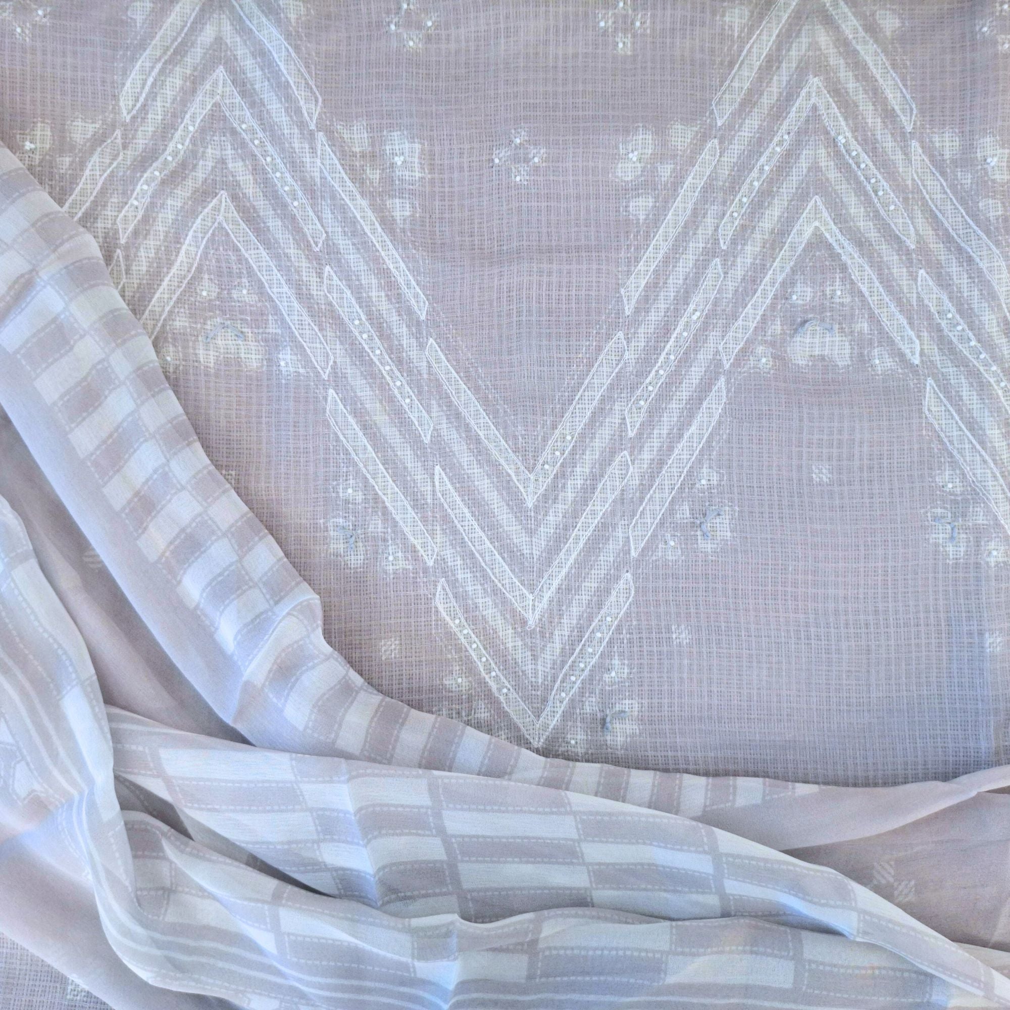 Modern geometry on classic linen, completed with a lightweight chiffon dupatta.