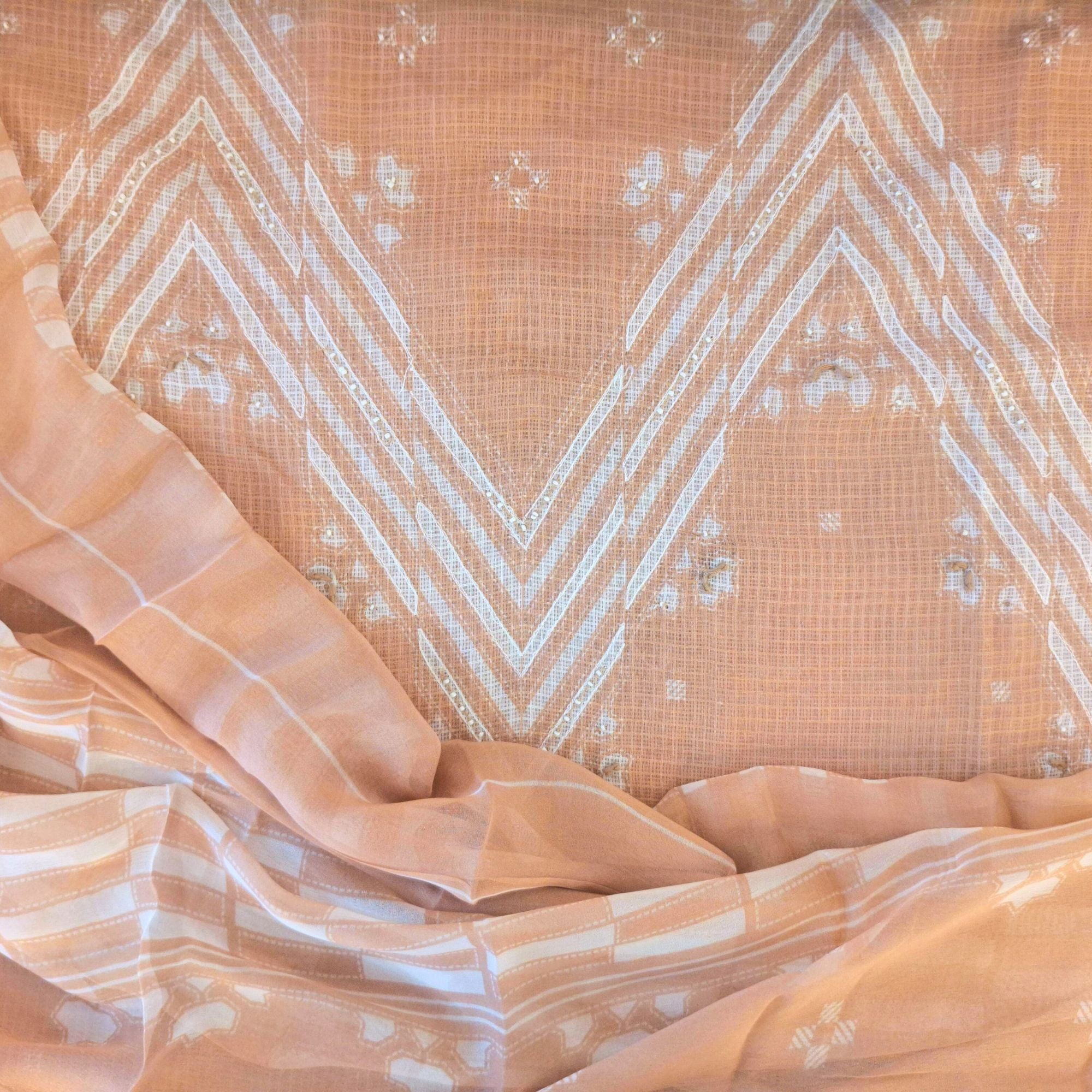 Modern geometry on classic linen, completed with a lightweight chiffon dupatta.