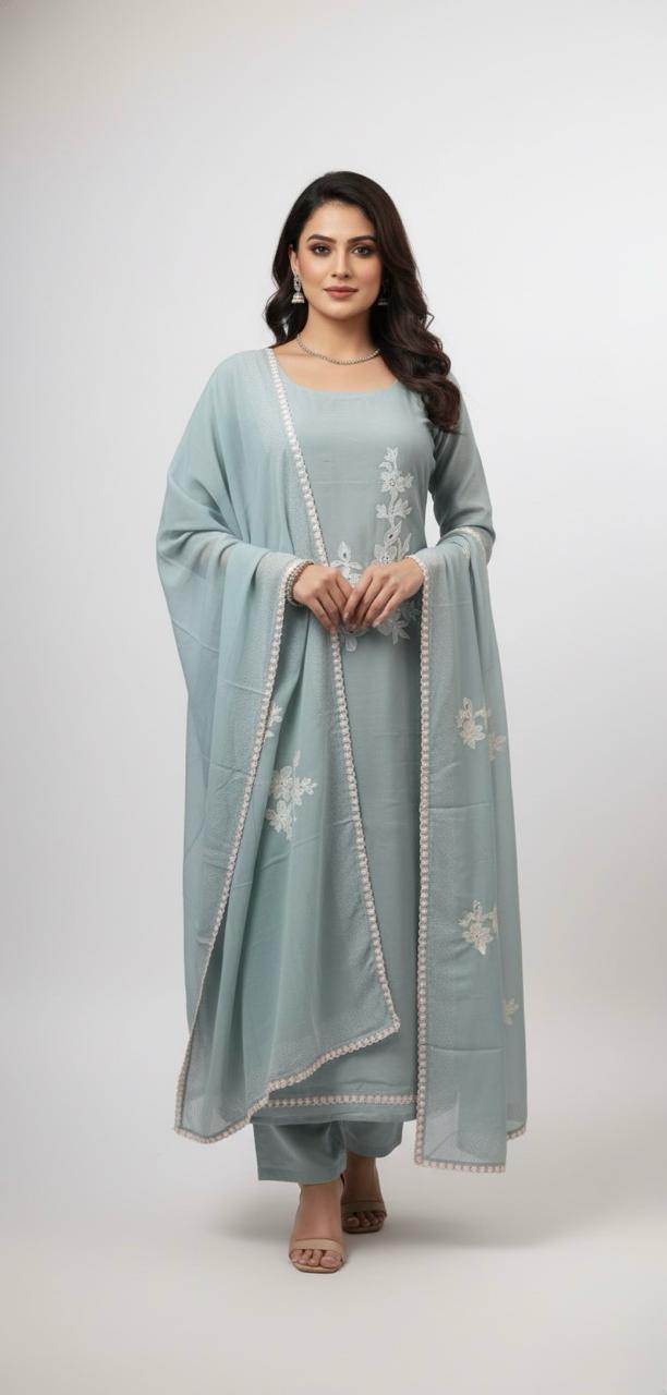 Muslin suit with intricate machine embroidery, paired with a muslin dupatta featuring delicate thread work lace — elegant and graceful.