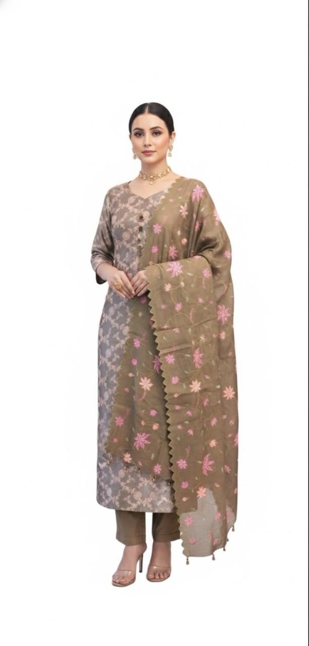 Opulent brocade suit adorned with jal patterns, paired with a delicately embroidered tissue dupatta.